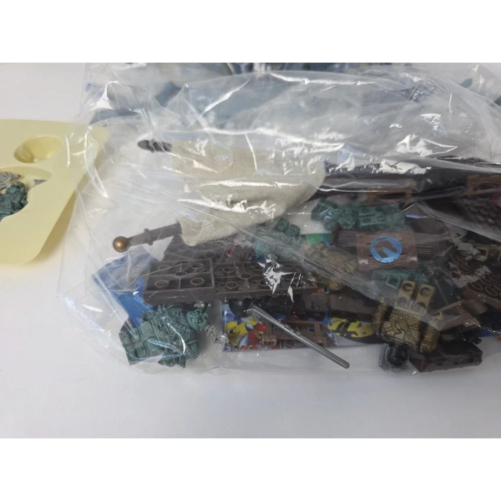 Large Mega Bloks lot Dragons Man o War pieces + challenge game pieces manuals